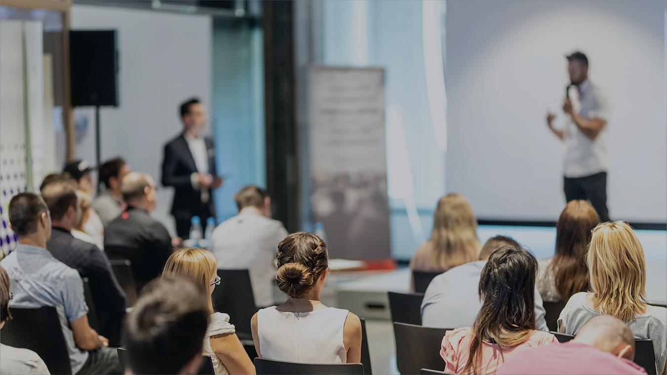 a small audience watching an event presentation additional questions progress compliance accessibility accommodate schedule services example regulations schedule access venues equipment construction services project construction