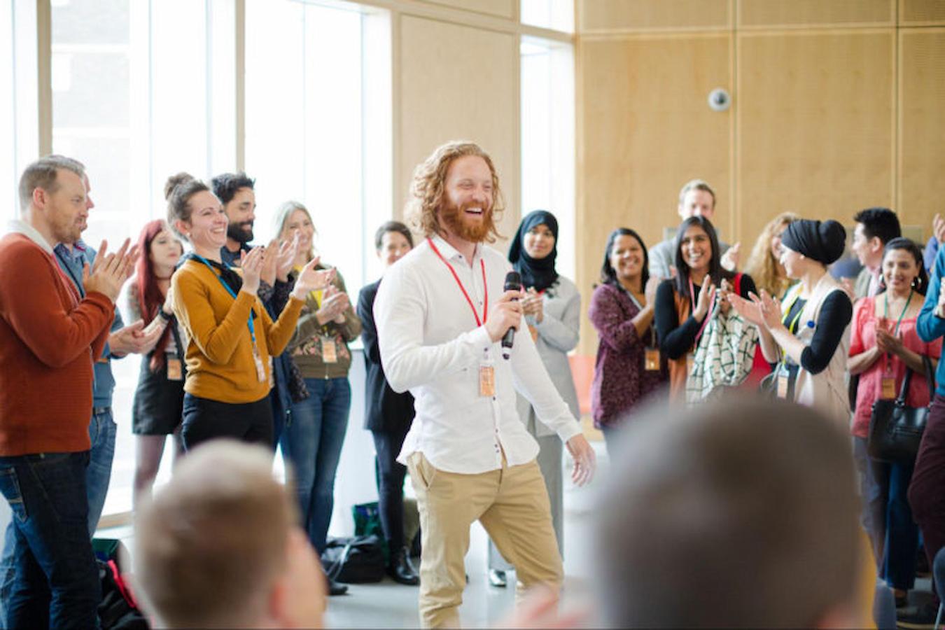 an emcee entertaining business people new customers gain access offer incentives focused audiences encourage consumers