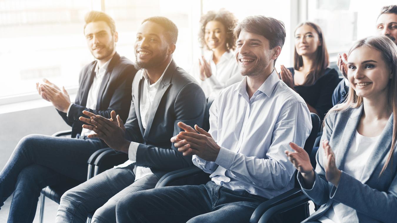 Attendees listen to keynote speakers deliver engaging personal talks