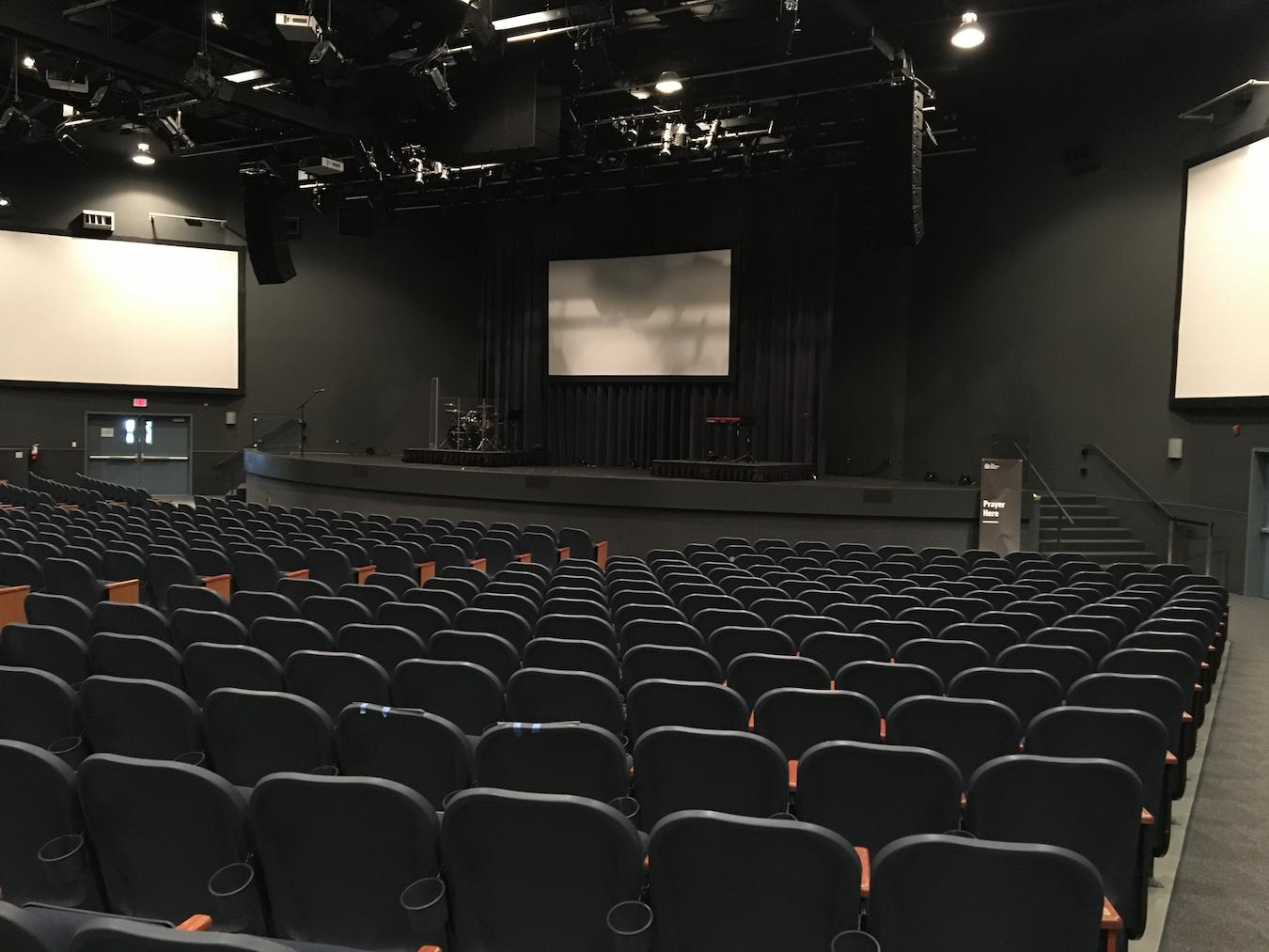 an empty theatre hall hosting services virtual emcees events