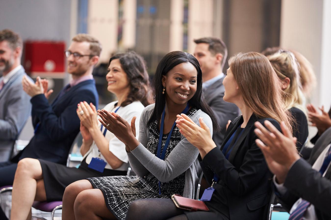 Guests clap for opening statement that had focus on hosting a funny team meeting