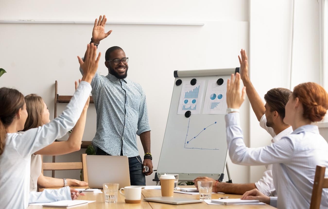 Man leads engaged audience activity with returning visitors