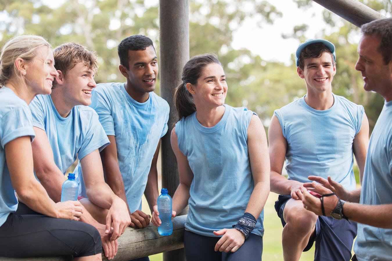 Outdoor employee engagement activity of six business leaders