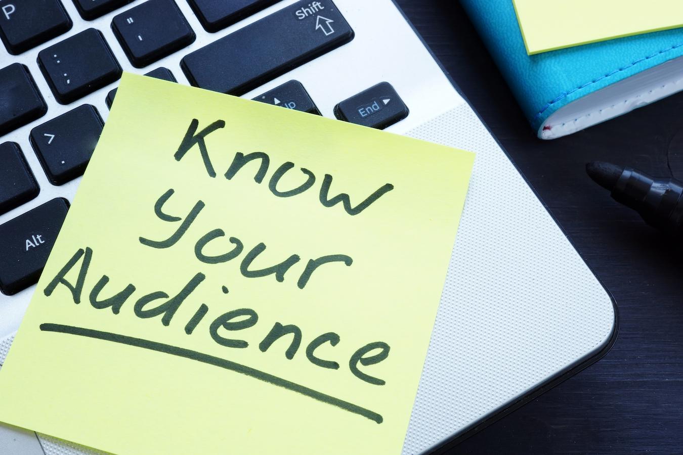 Post it note on laptop says know your audience