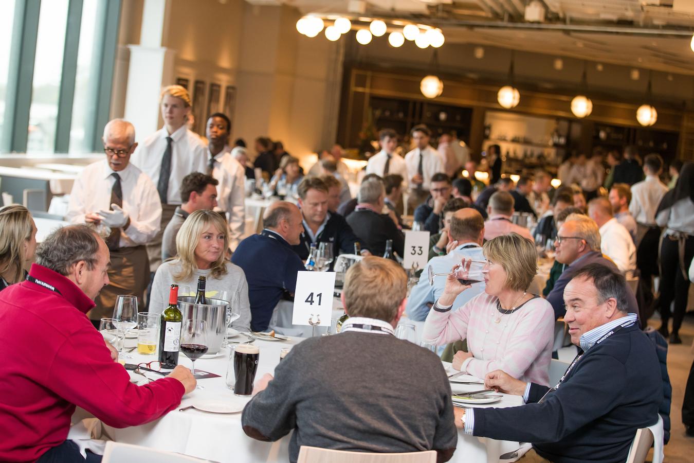 some business people eating at a group dinner organisation corporate hospitality ideas excitement community marketing benefits guests client companies entertainment build trust businesses guests food definition entertainment client benefits businesses