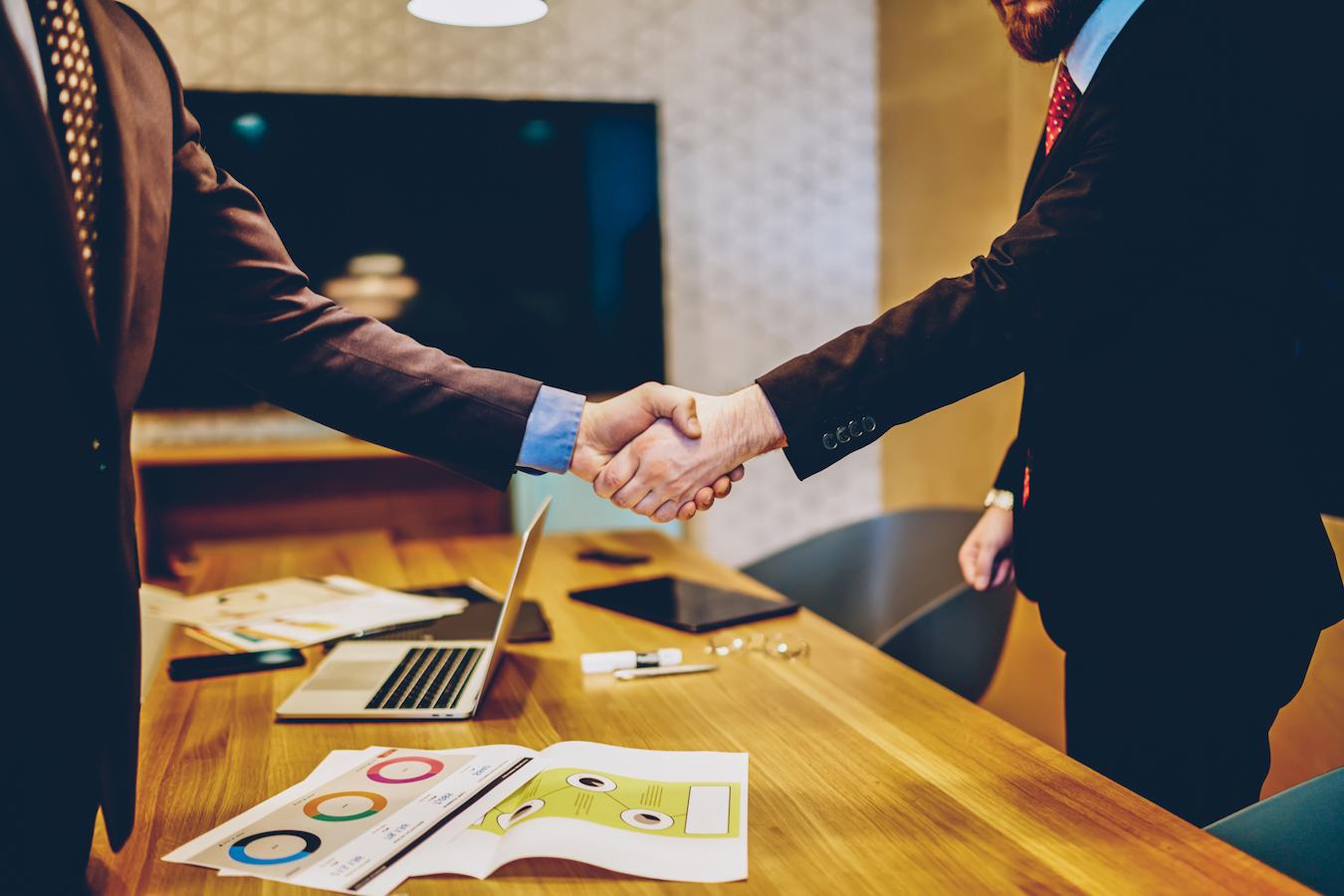 Sponsor and host shake hands and agree to work together on related events