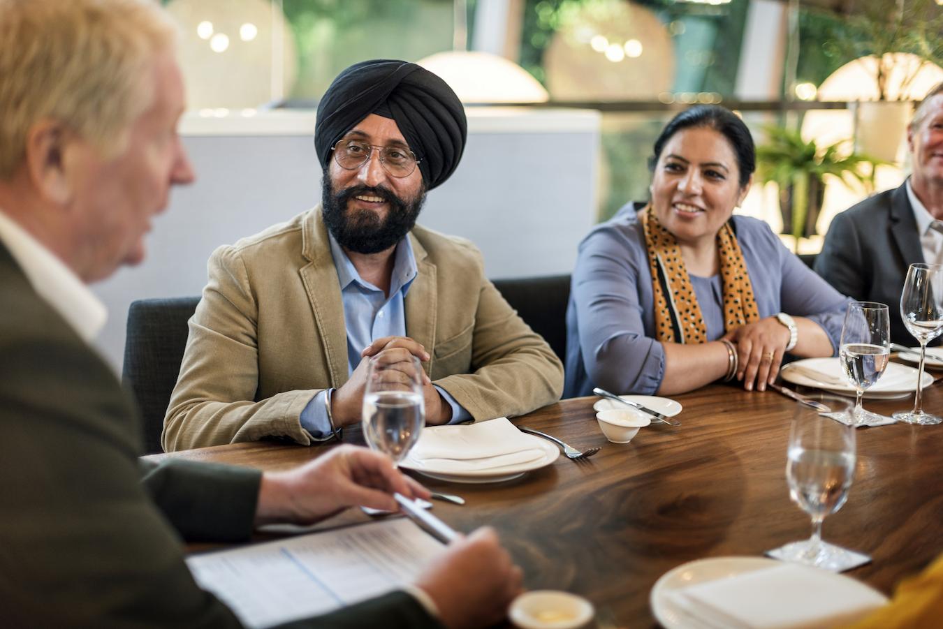 Team reduces stress at dinner after week of business appointments