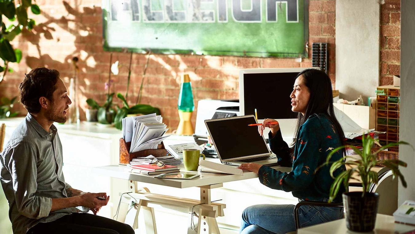 two people talking while working at a cozy setup core value company values based same page company value corporate values recognition programs ongoing exercise core values concrete examples own words idea flow slows key word team member relevant decades internal image core values falling short new values affinity diagram core values